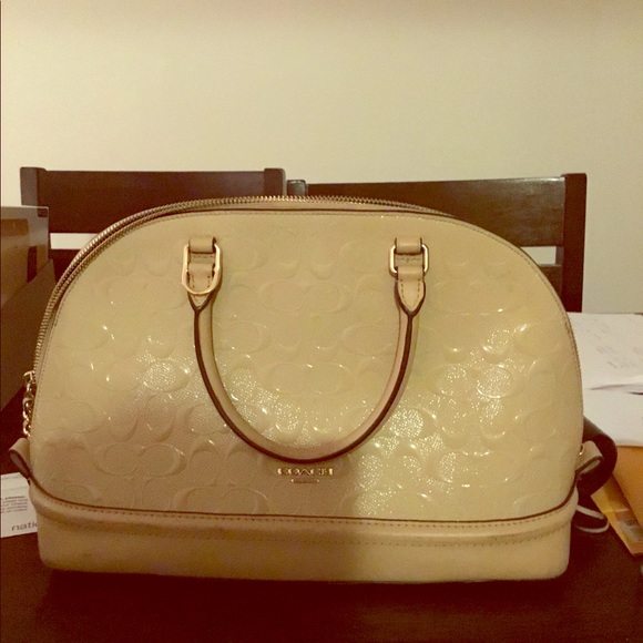 beige coach purse